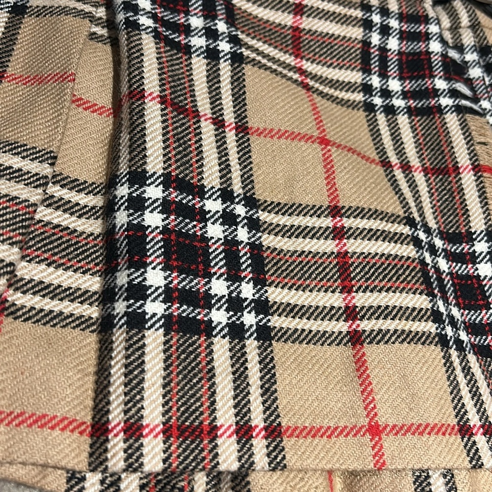 Toddler plaid skirt measures approximately 10 1/2 inches across the waist. - Picture 4 of 8